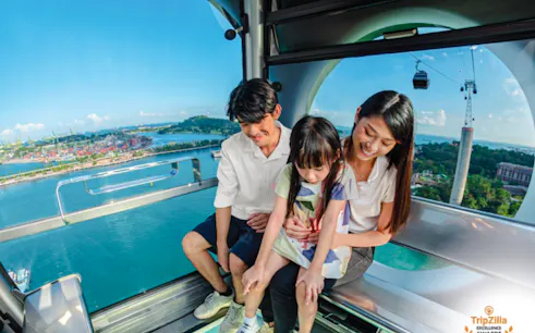 Family enjoying view from Singapore Cable Car SkyOrb Cabin, Sentosa.