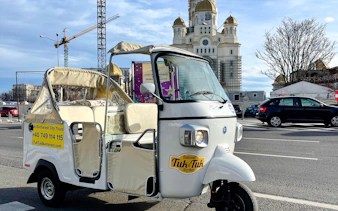 Tuk Tuk in front of a church during Bucharest Highlights Tour.