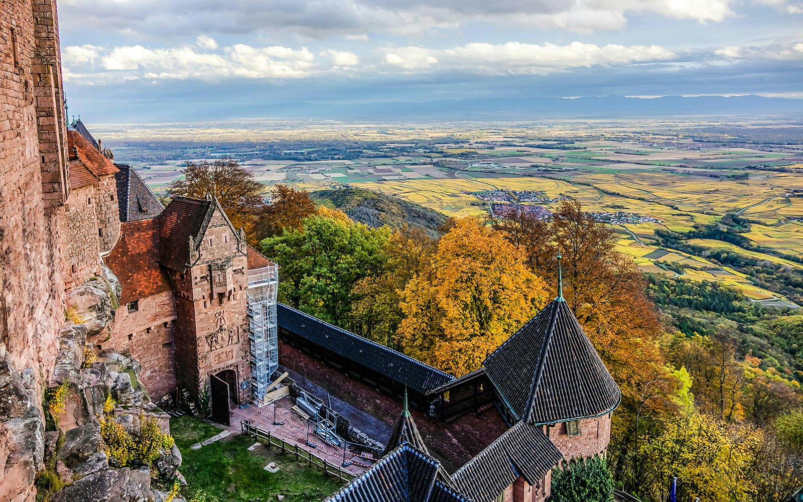 Aerial view from Haut-Koenigsbourg Castle overlooking Alsace countryside and autumn foliage.