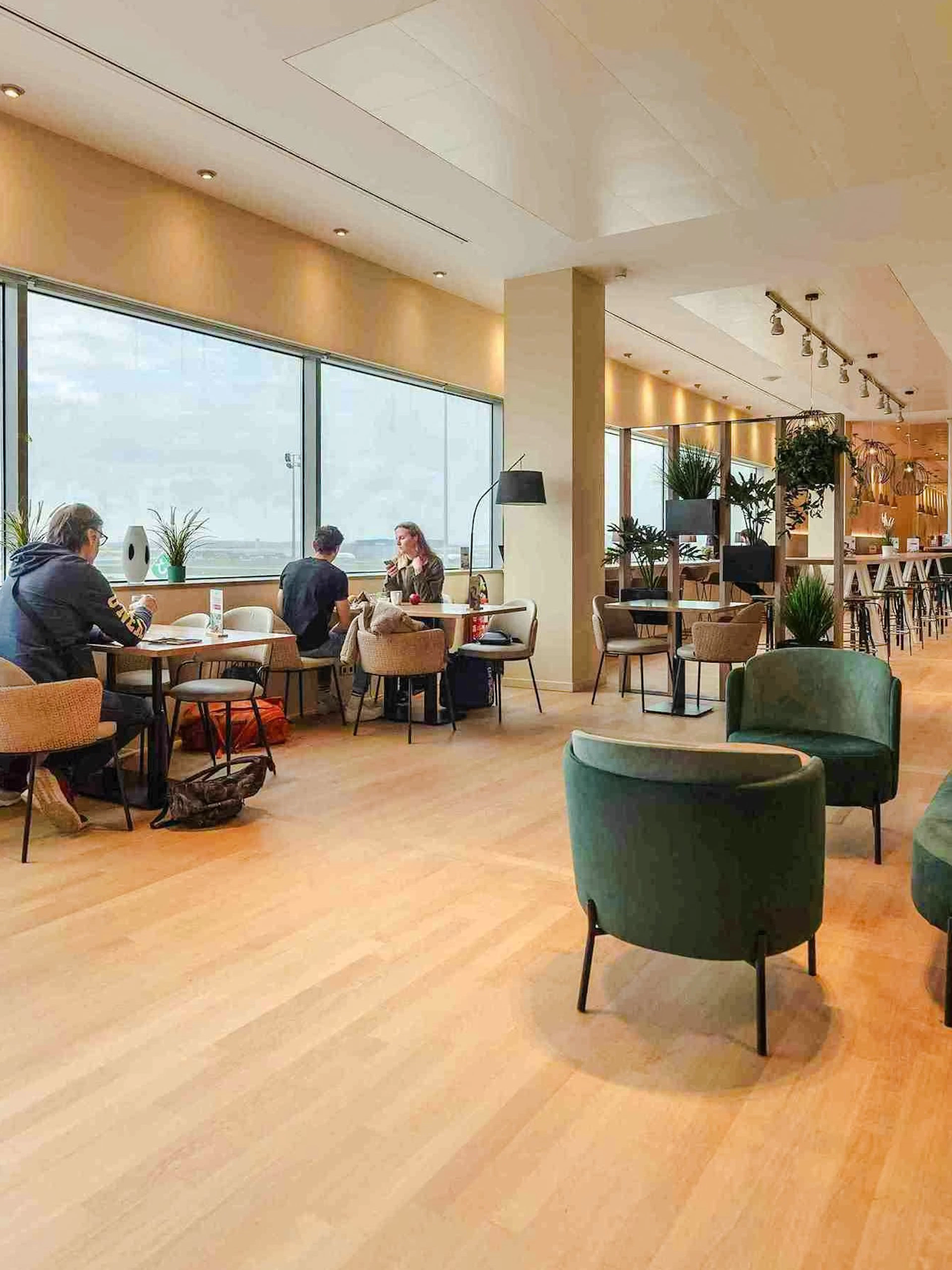 Brussels Airport Lounge interior with seating and large windows.