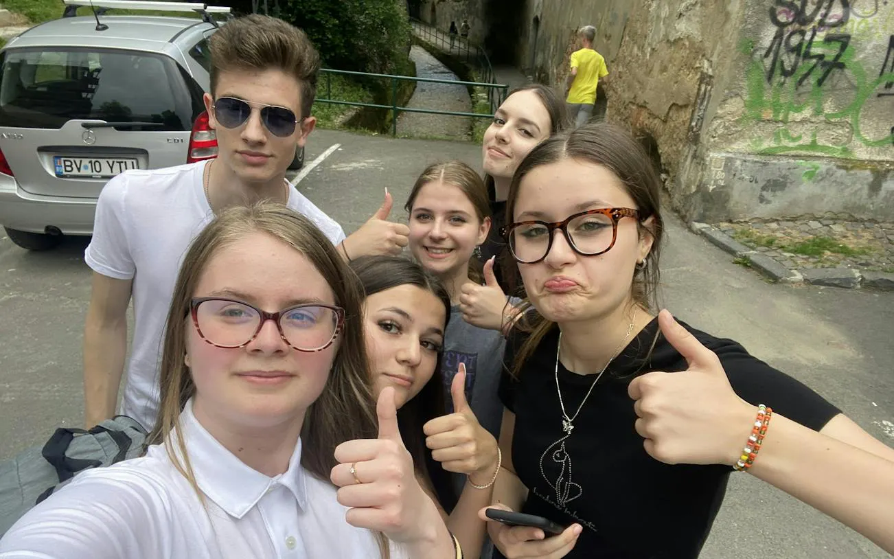 Group of young people exploring Brasov during a self-guided city game.