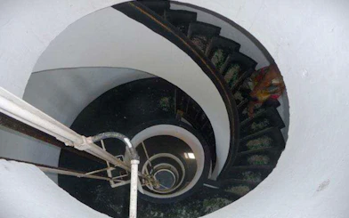 Spiral staircase inside Mandacaru Lighthouse, part of Preguiças River Circuit tour.