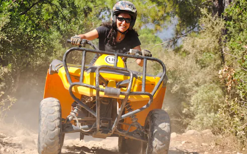 ATV rider navigating a dusty trail in the Taurus Mountains, Kemer, Antalya.