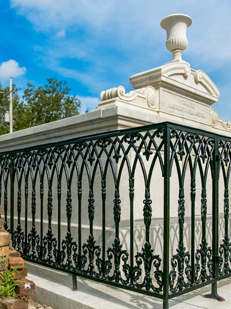 Tomb with ornate iron fence in St. Louis Cemetery, New Orleans.