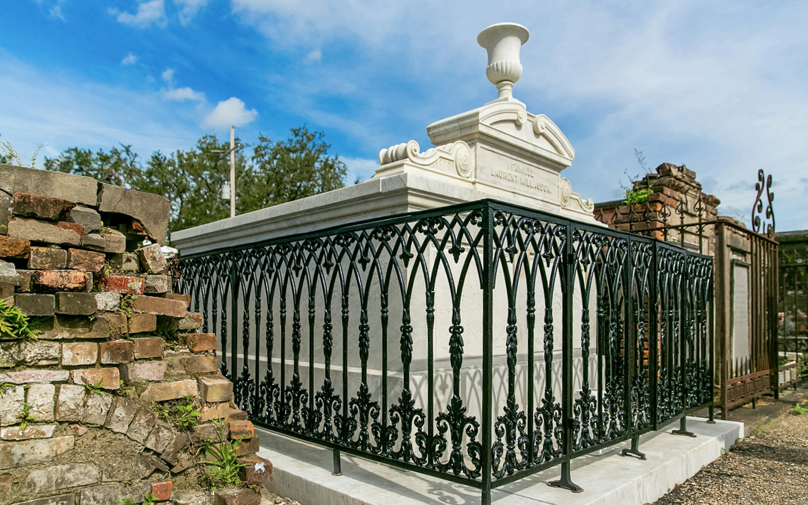 Tomb with ornate iron fence in St. Louis Cemetery, New Orleans.