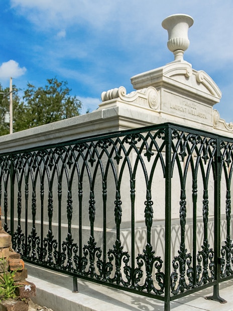 Tomb with ornate iron fence in St. Louis Cemetery, New Orleans.