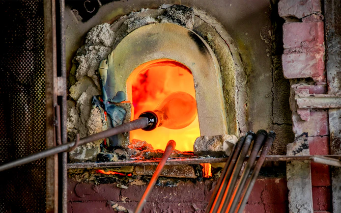 Glassblowing in a Murano furnace during Venice afternoon tour from Punta Sabbioni.