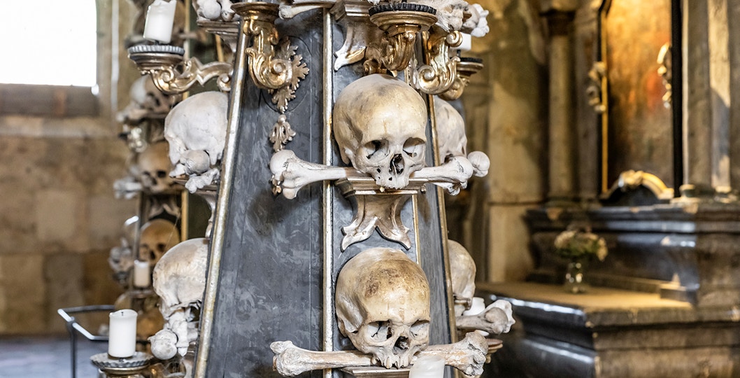 Candlestick made of human bones and skulls in Kostnice Sedlec chapel, Kutna Hora.