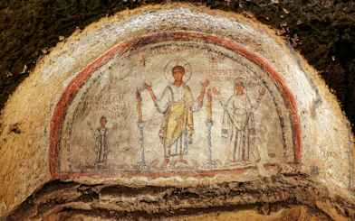Ancient frescos at Catacombs of San Gennaro in Naples on a guided tour.