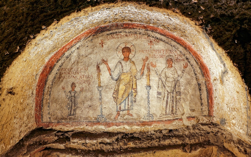 Ancient frescos at Catacombs of San Gennaro in Naples on a guided tour.