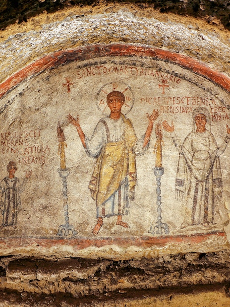 Ancient frescos at Catacombs of San Gennaro in Naples on a guided tour.