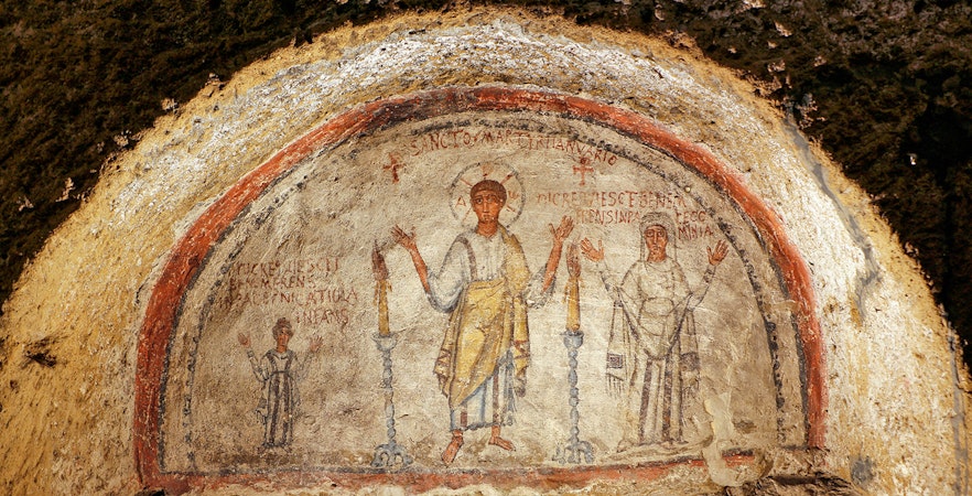 Ancient frescos at Catacombs of San Gennaro in Naples on a guided tour.
