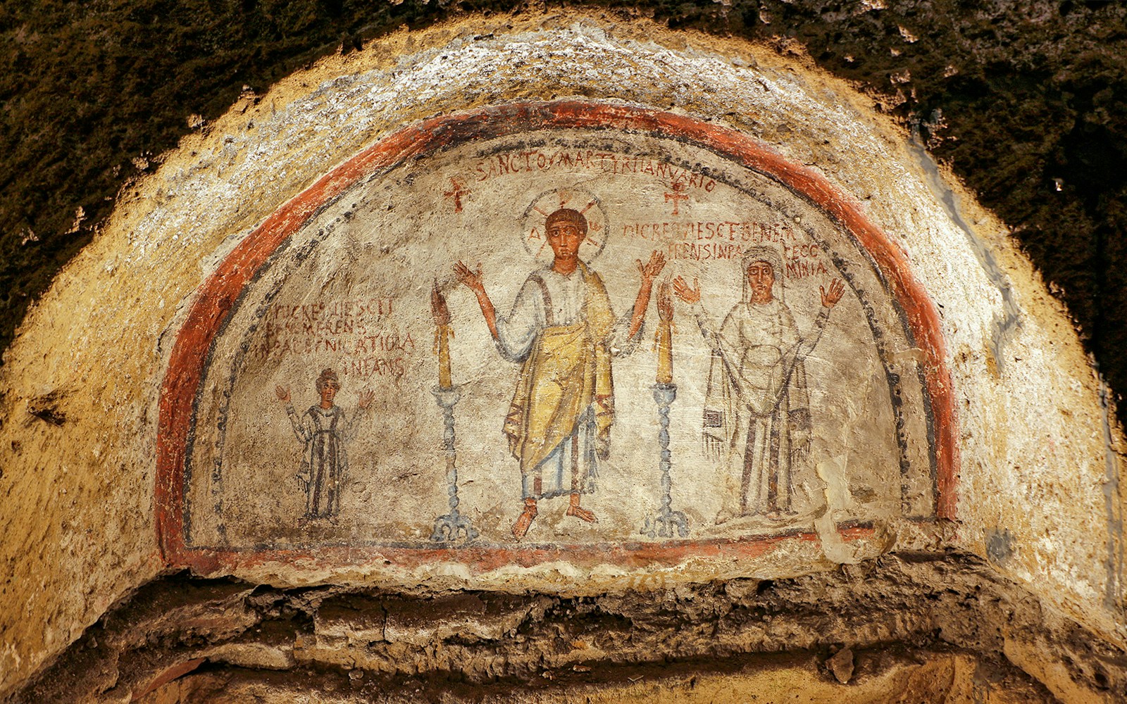 Early Christian art at Catacombs of San Gennaro in Naples with ancient frescoes and burial sites.