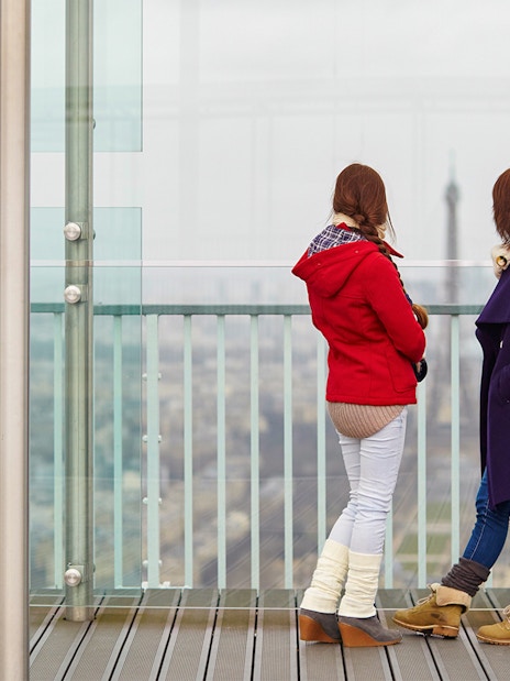 Visitors on Montparnasse Tower 56th Floor Roof Terrace, Paris.