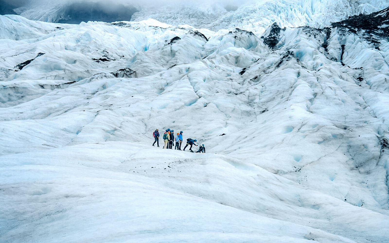 Group hiking on Vatnajökull Glacier, Iceland.