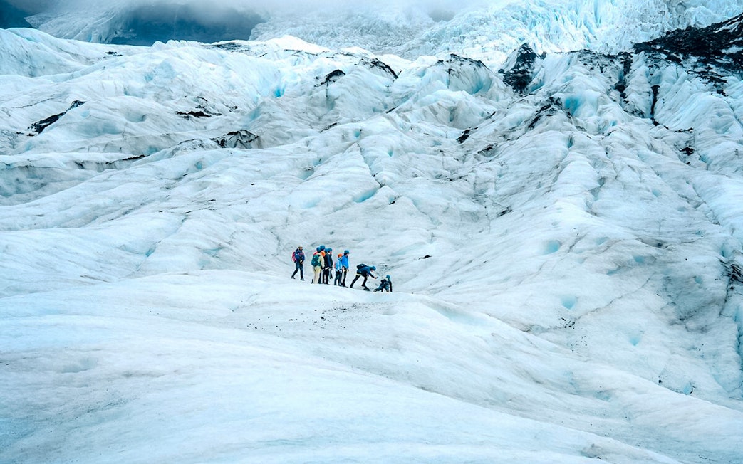 Group hiking on Vatnajökull Glacier, Iceland.