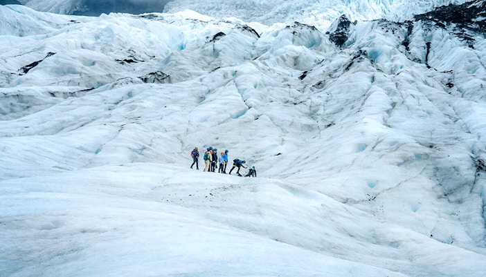 Group hiking on Vatnajökull Glacier, Iceland.
