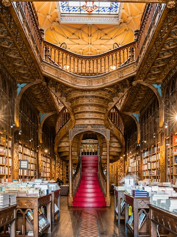 Lello Library's ornate staircase and bookshelves in Porto, Portugal.