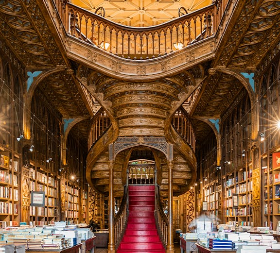 Lello Library's ornate staircase and bookshelves in Porto, Portugal.