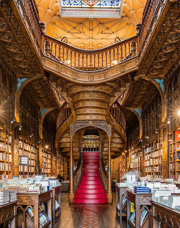 Lello Library's ornate staircase and bookshelves in Porto, Portugal.