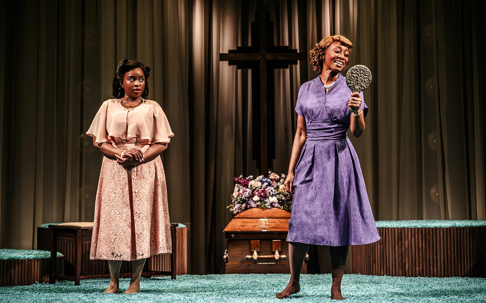 Two performers on stage in "Marie & Rosetta" production, one singing with a microphone.