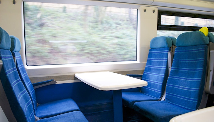 Eurostar train seats with table and window view.