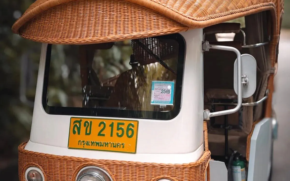 Tuk-tuk with woven roof in Bangkok, Thailand, used for Ultimate Nightlife Rooftop Bar Hopping.