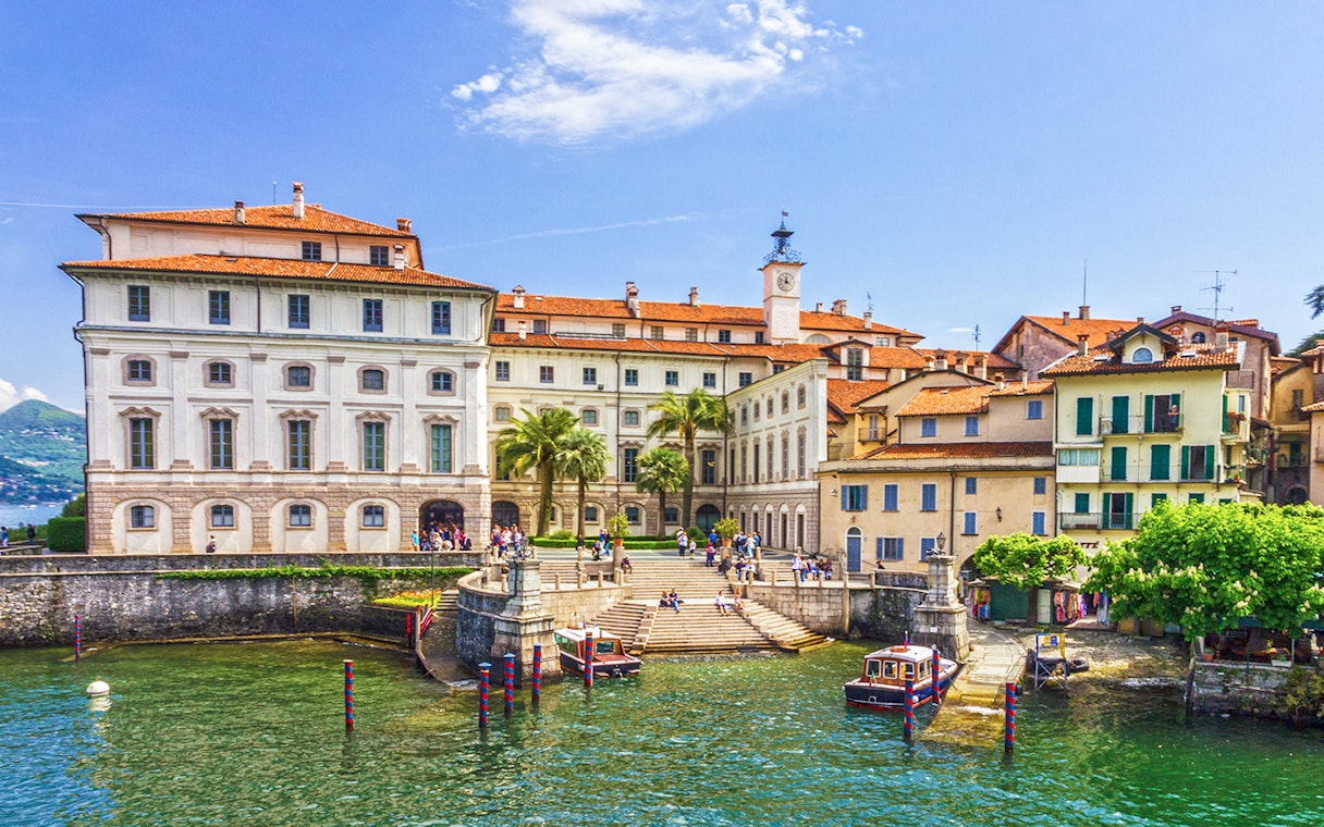 Isola Bella waterfront with historic buildings and boats, Italy.