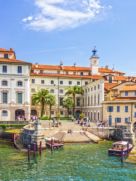 Isola Bella waterfront with historic buildings and boats, Italy.