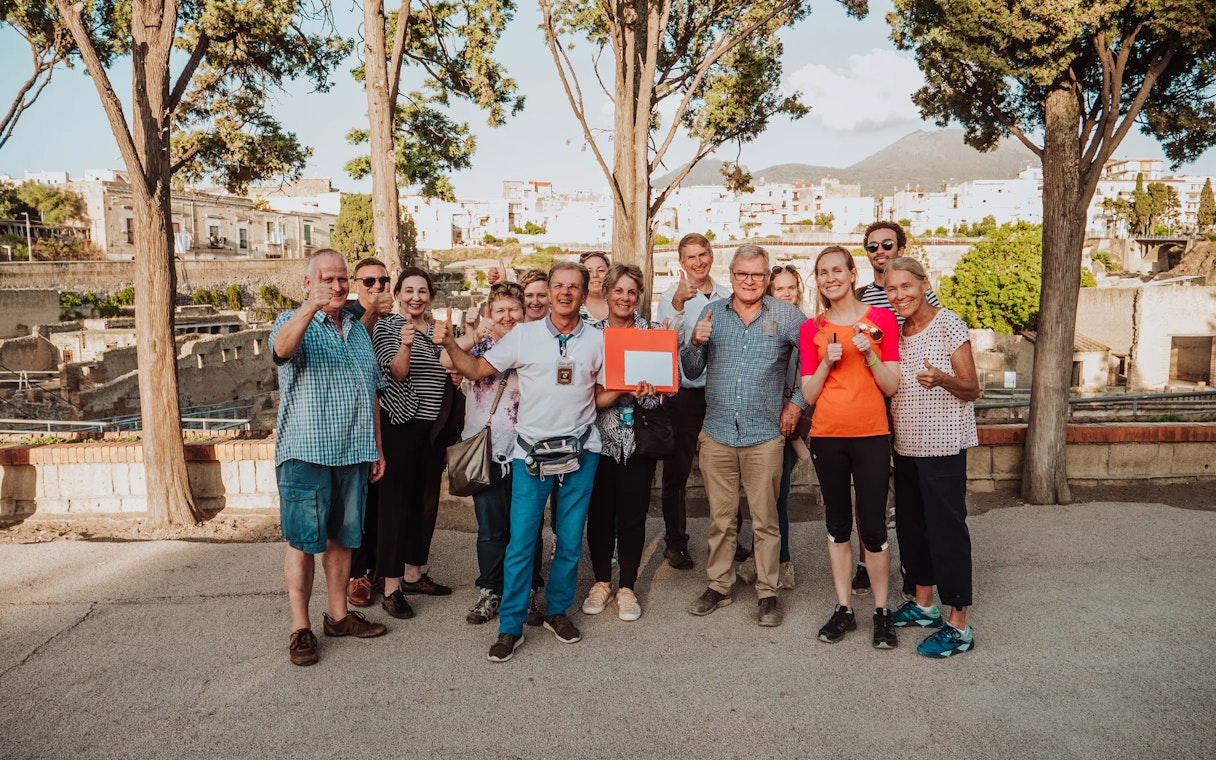 Group of tourists on a guided tour at Herculaneum with skip-the-line tickets.
