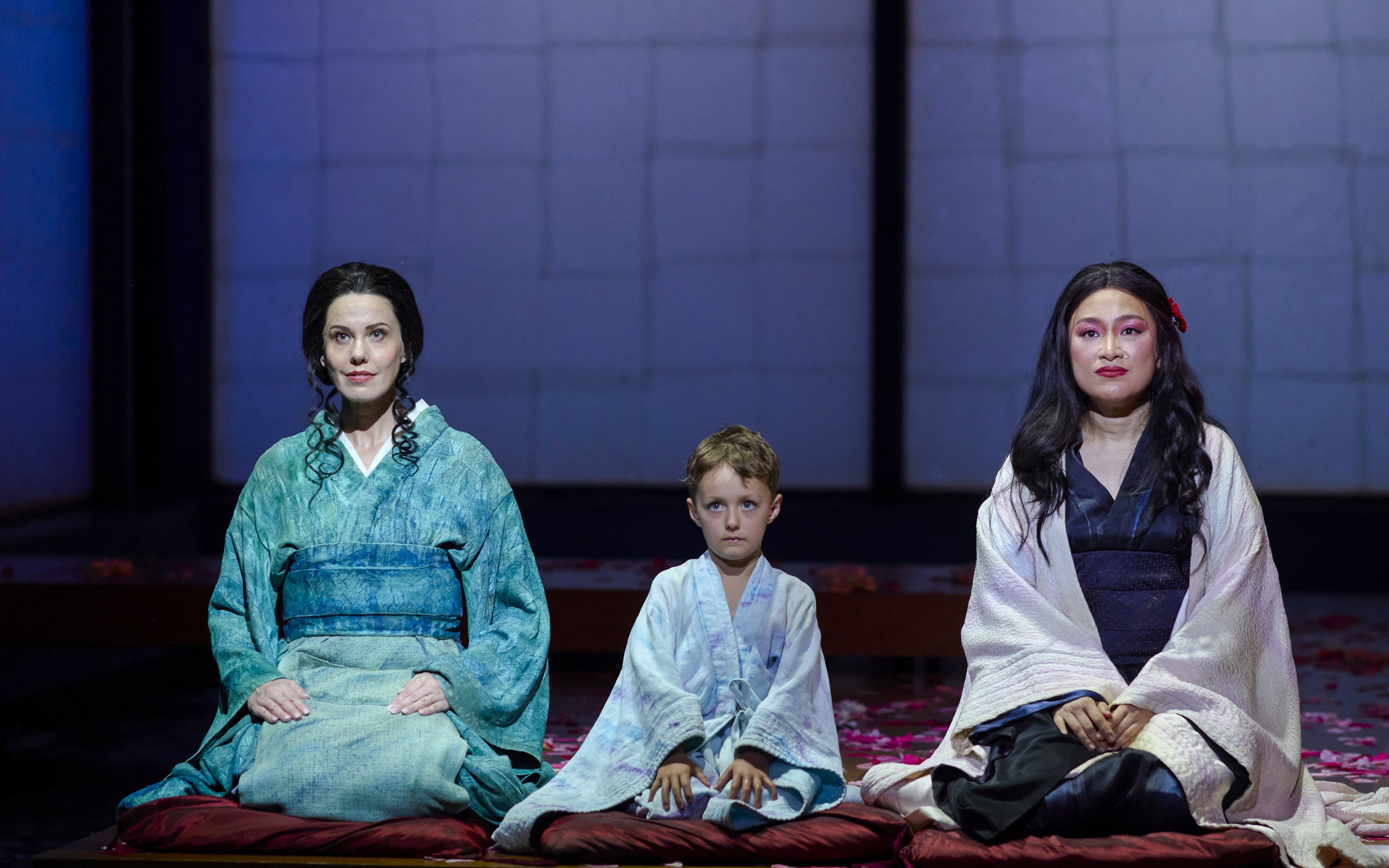 Stage performance of Madama Butterfly in Sydney with three actors in traditional attire.