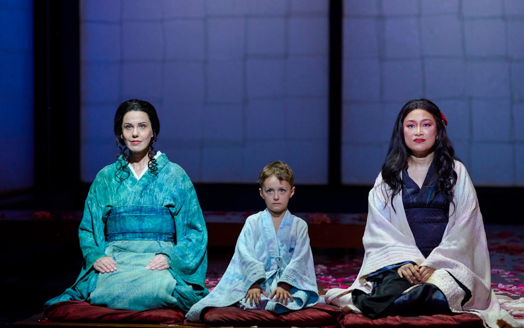 Stage performance of Madama Butterfly in Sydney with three actors in traditional attire.