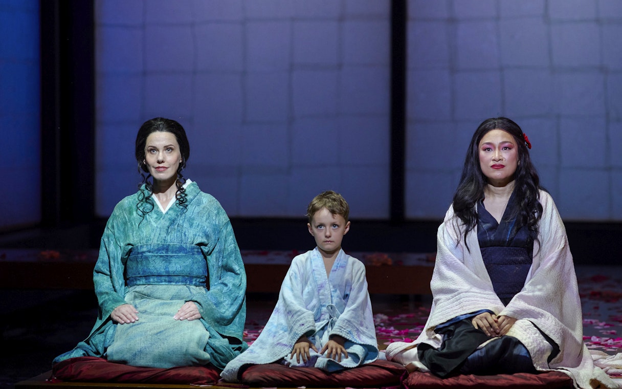 Stage performance of Madama Butterfly in Sydney with three actors in traditional attire.
