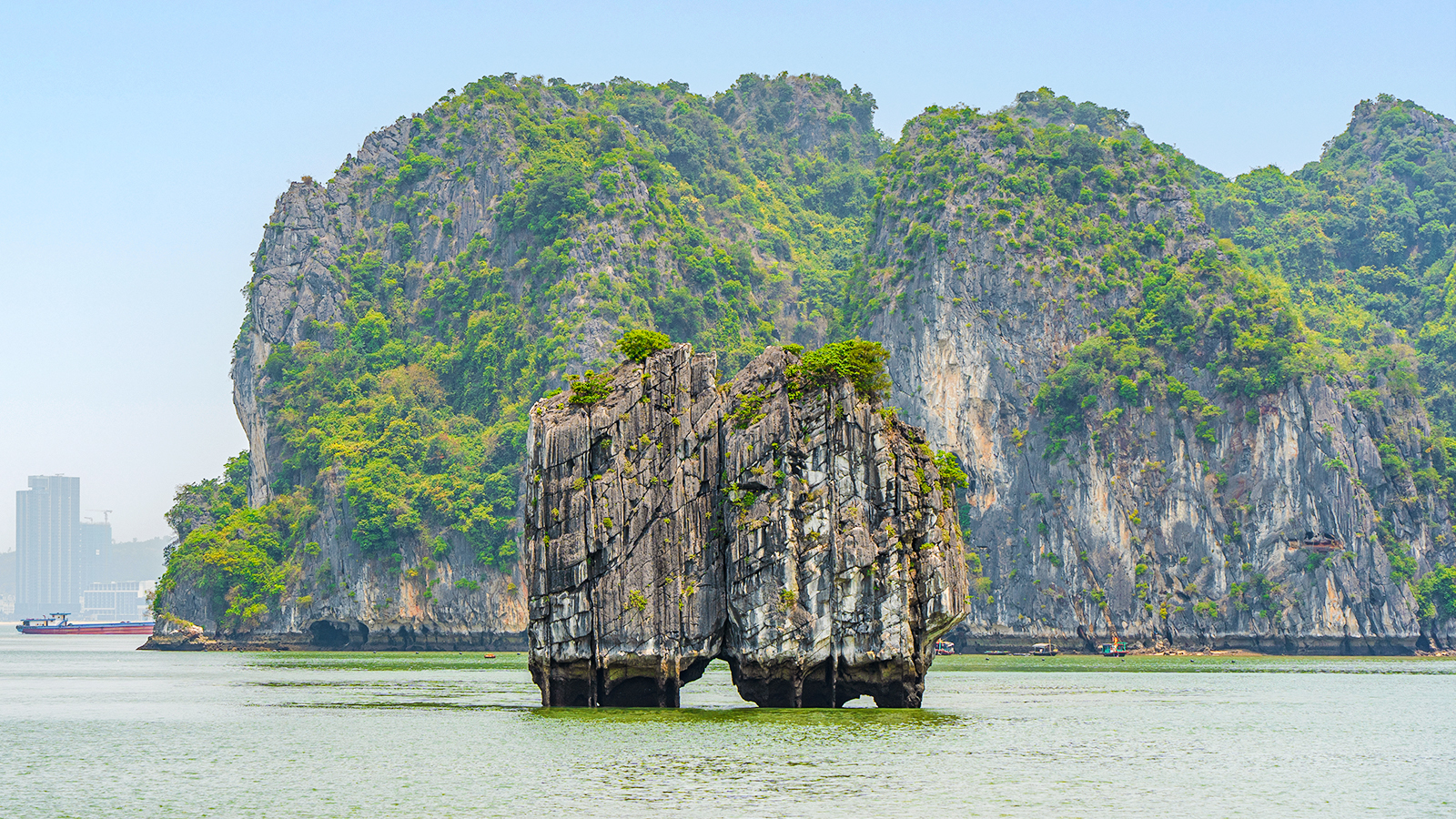 Dinh Huong Islet in Ha Long Bay, Quang Ninh, Vietnam, surrounded by emerald waters and limestone formations.
