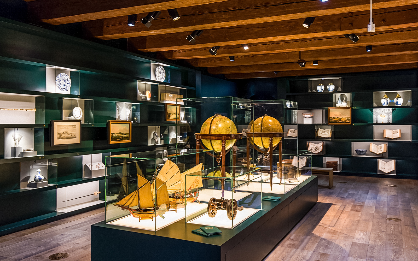 Exhibit of globes and maritime artifacts inside The Maritime Museum, Amsterdam.