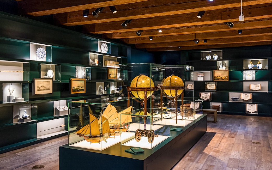 Exhibit of globes and maritime artifacts inside The Maritime Museum, Amsterdam.