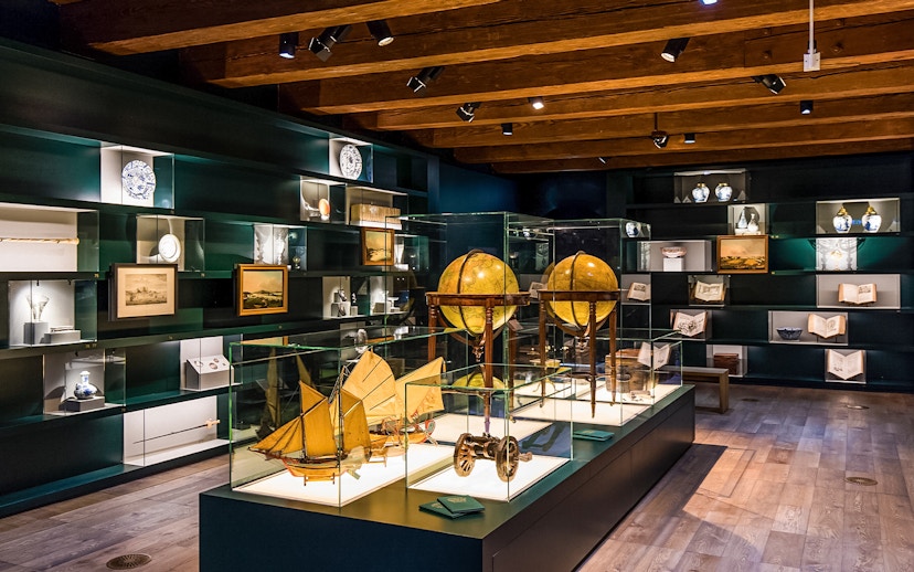 Exhibit of globes and maritime artifacts inside The Maritime Museum, Amsterdam.