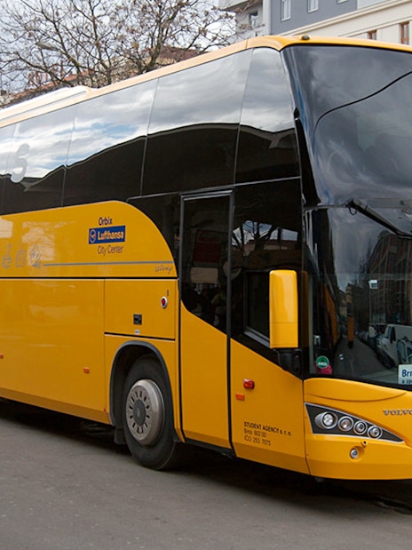 Yellow bus for Prague Airport to City Center transfer.