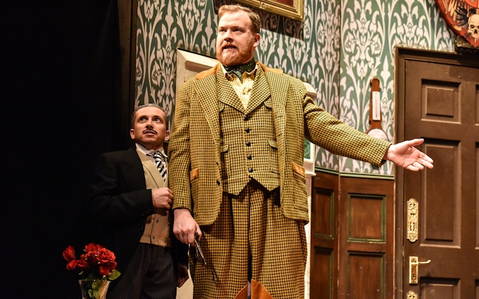 Actors performing a scene from "The Play That Goes Wrong" on stage.