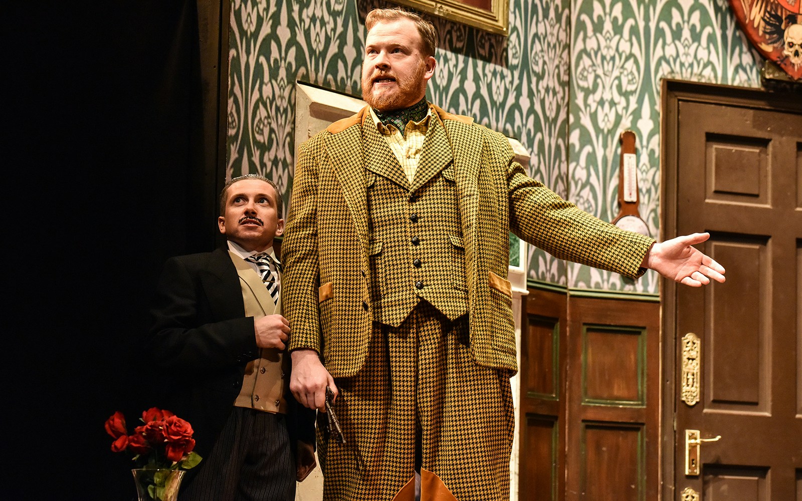 Actors performing a scene from "The Play That Goes Wrong" on stage.