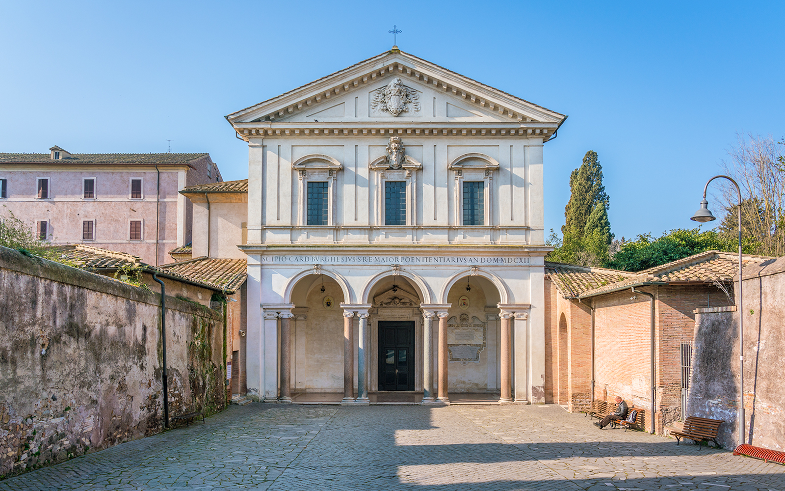 Basilica of San Sebastian facade in Rome with arched entrance and historical architecture.