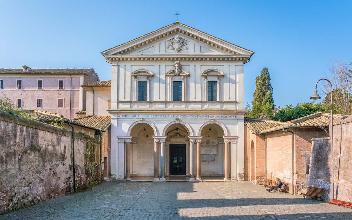 Basilica of San Sebastian facade in Rome with arched entrance and historical architecture.