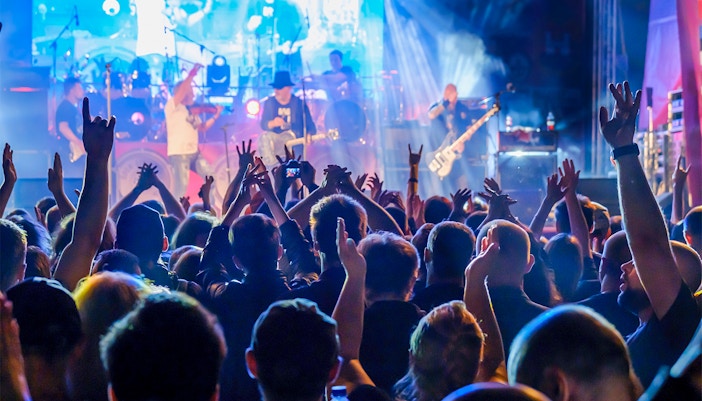 Crowd enjoying live music performance at Hampton Court Flower Show.