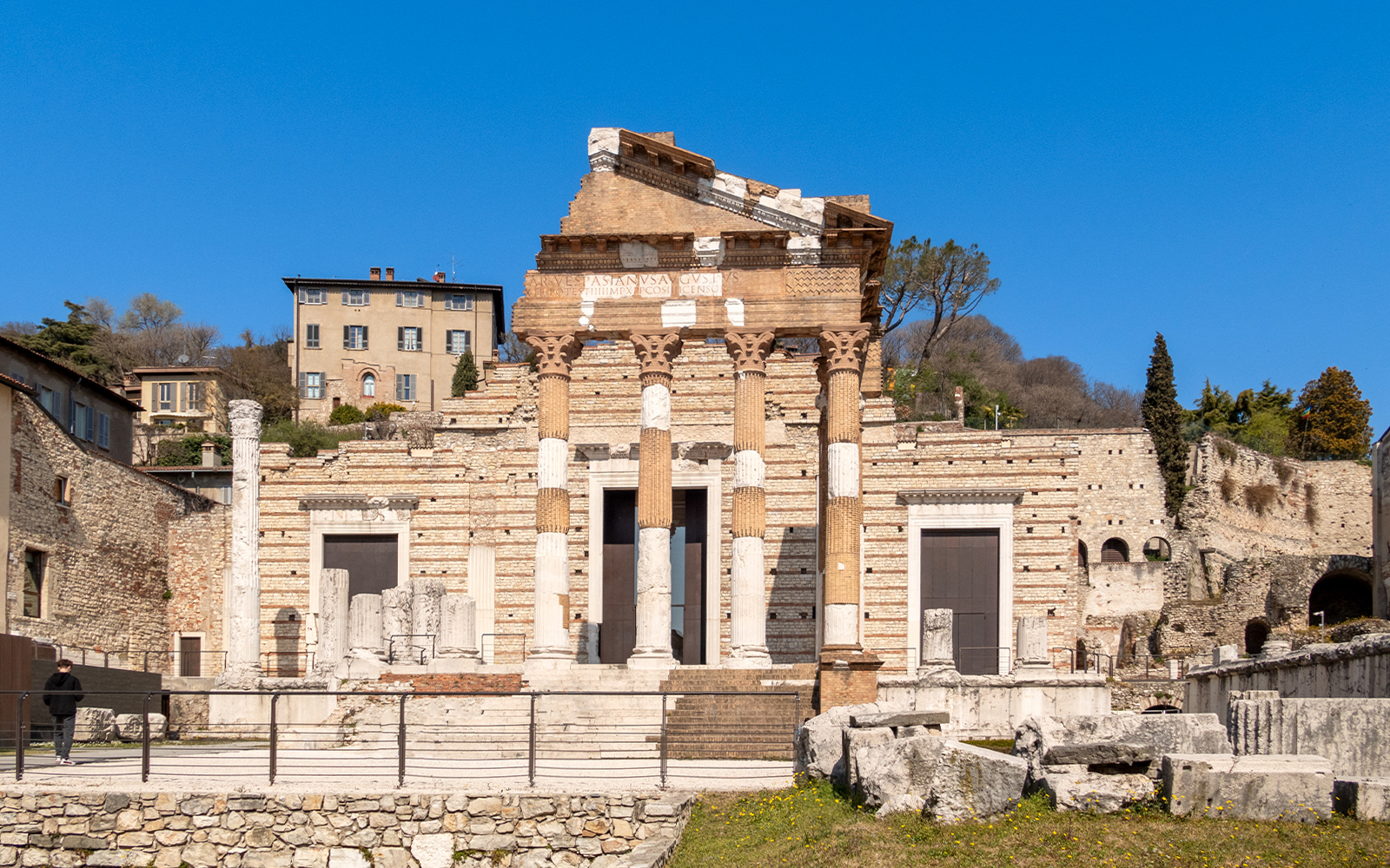 Capitolium ruins in Rome, Italy, showcasing ancient Roman architecture at a World Heritage Site.