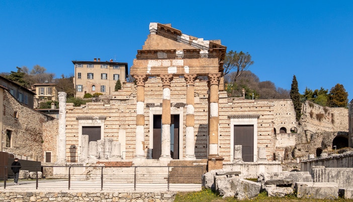 Capitolium ruins in Rome, Italy, showcasing ancient Roman architecture at a World Heritage Site.