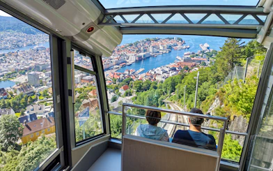 View from funicular descending Mt Floyen overlooking Bergen, Norway with harbor and cityscape.