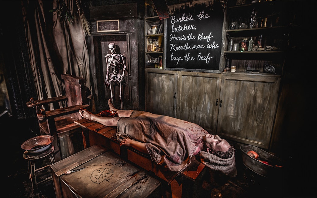 Dr Knox's Anatomy Theatre with a skeleton and a figure on a table.