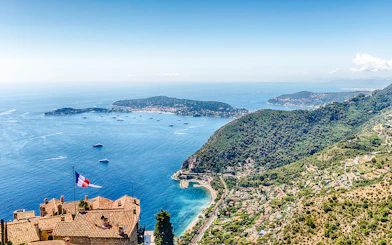 Aerial view of Èze village rooftops and coastline, Cote d'Azur, France.