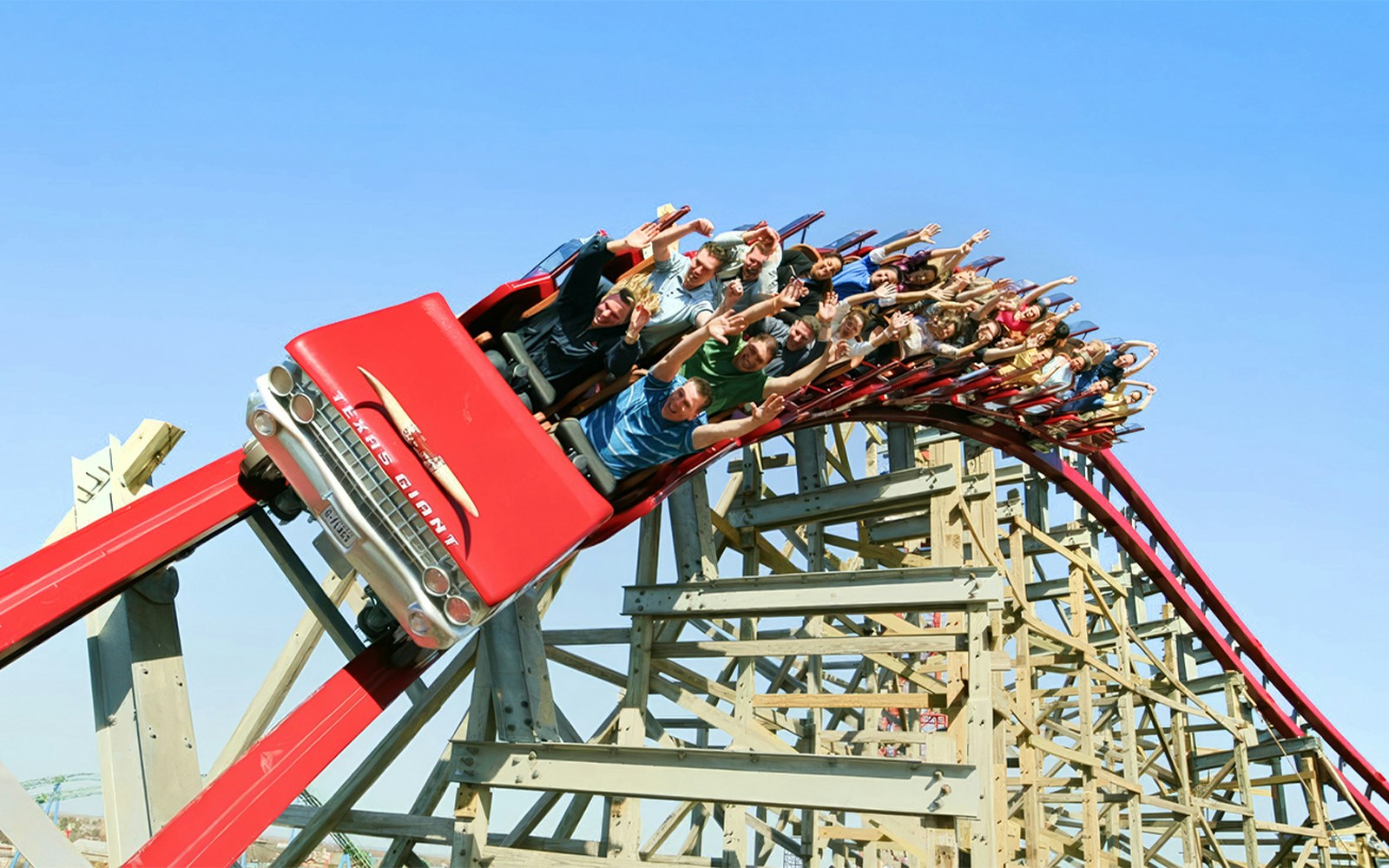 Riders on the New Texas Giant roller coaster at Six Flags Over Texas.