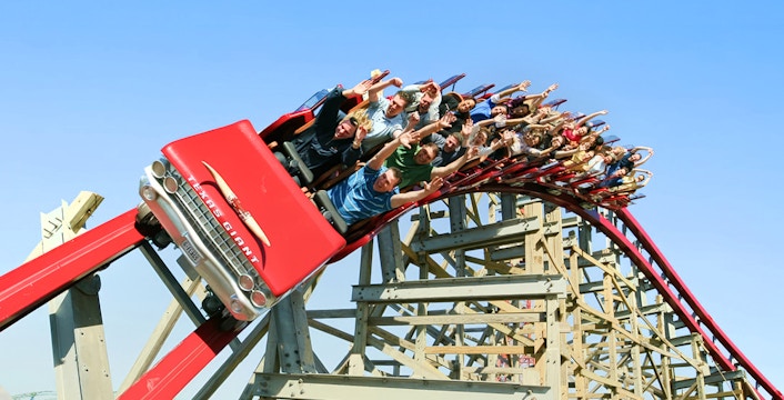 Riders on the New Texas Giant roller coaster at Six Flags Over Texas.